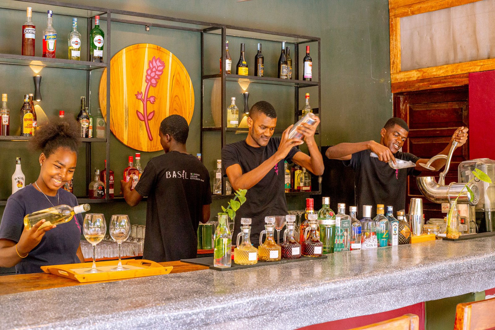 The bar at Basil, Paje — bartenders mixing signature cocktails
